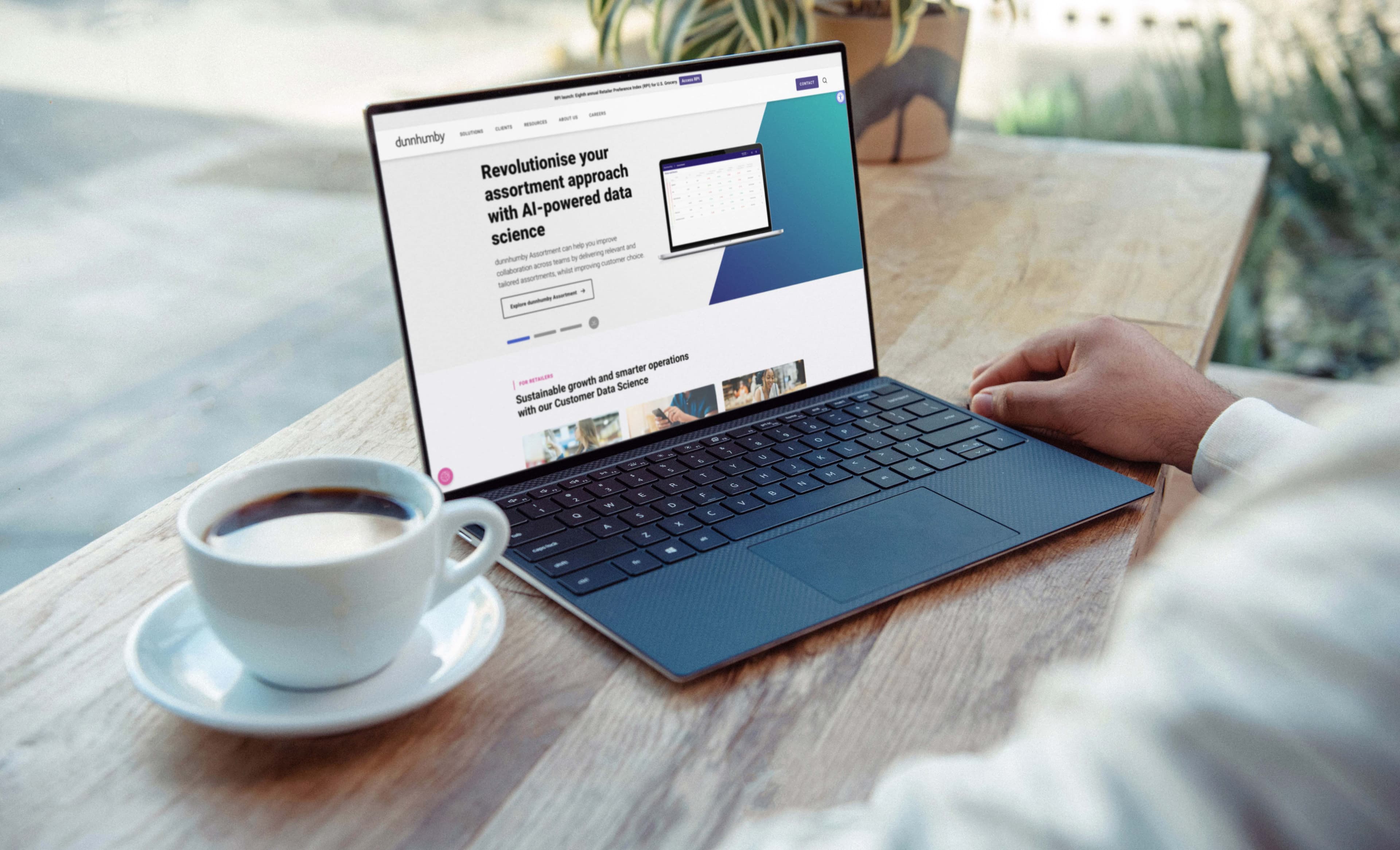 A laptop on a balcony table displays BT's business solutions website, with a headline reading "We've got your back" and sections highlighting connectivity, support, and security.